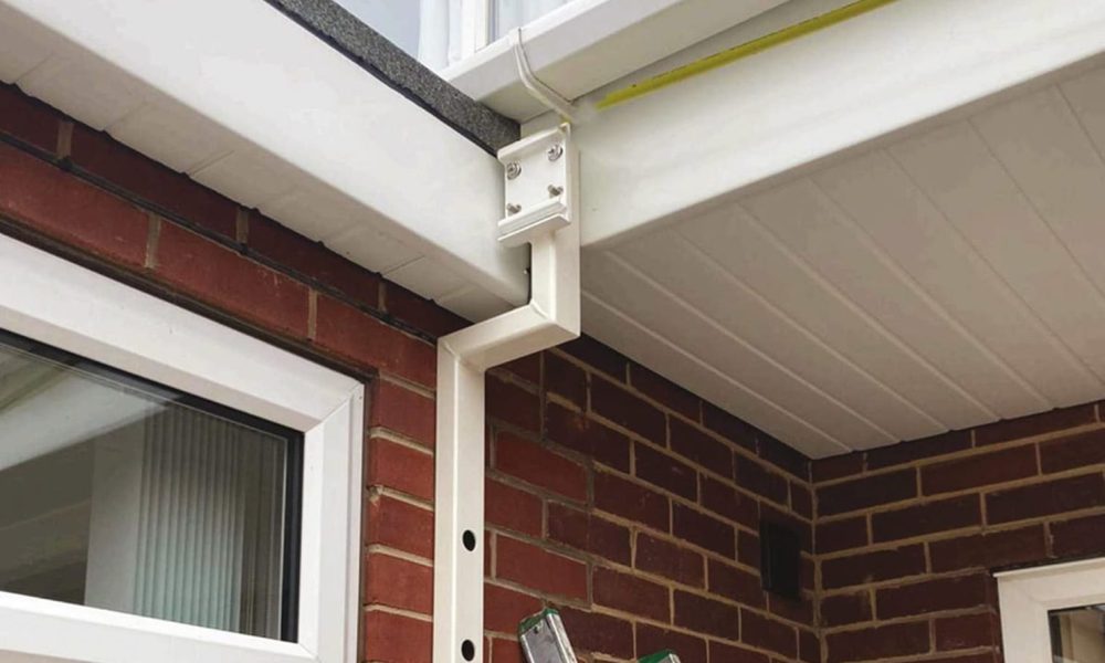 Close up of an awning bracket on a UK home made from red brick